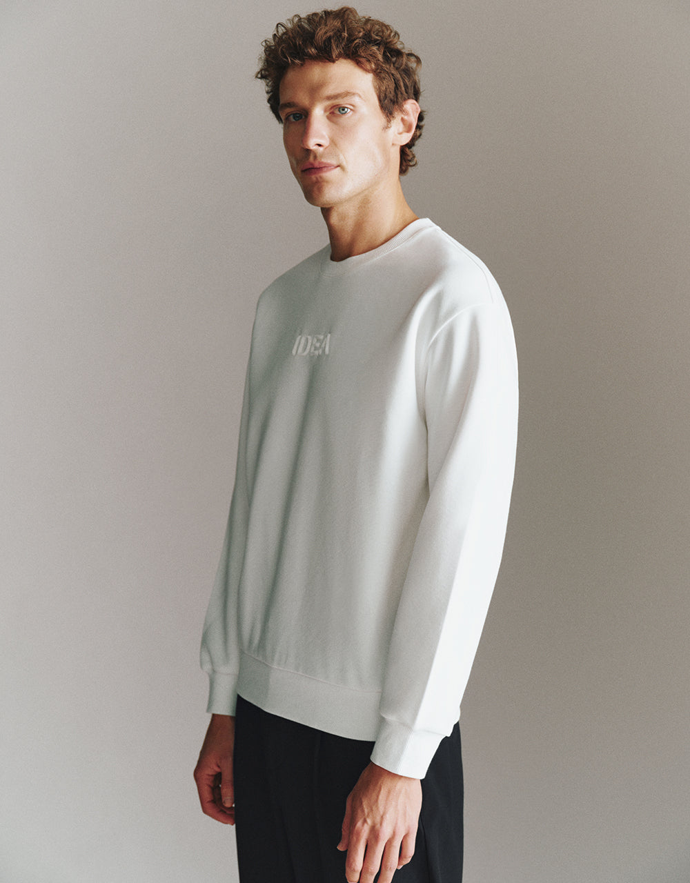 Letter Embossed Crew Neck Sweatshirt