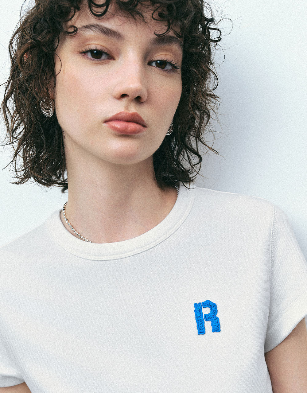 Letter Embossed Crew Neck T-Shirt